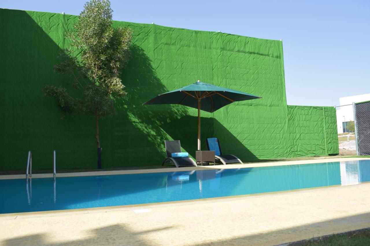 Retaj Salwa Resort & Spa Доха Екстер'єр фото A swimming pool in Spain